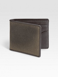 A classic water resistant fabric, waxwear acquires a beautiful patina with age and use. French-edged with leather, this bill holder mixes utilitarian and luxe materials to create a uniquely masculine wallet.One billfold compartmentSix card slotsWaxed cotton/leather4W x 4HImported A classic water resistant fabric, waxwear acquires a beautiful patina with age and use. French-edged with leather, this bill holder mixes utilitarian and luxe materials to create a uniquely masculine wallet.One billfold compartmentSix card slotsWaxed cotton/leather4W x 4HImported