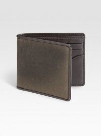 A classic water resistant fabric, waxwear acquires a beautiful patina with age and use. French-edged with leather, this bill holder mixes utilitarian and luxe materials to create a uniquely masculine wallet.One billfold compartmentSix card slotsWaxed cotton/leather4W x 4HImported