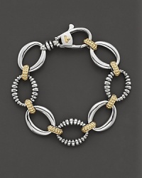 Sterling silver and 18 kt yellow gold, smooth and fluted oval link bracelet with lobster closure. Designed by Lagos. Sterling silver and 18 kt yellow gold, smooth and fluted oval link bracelet with lobster closure. Designed by Lagos.