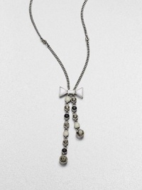 A long, graceful chain with an oxidized finish dangles a lariat of faceted stone strands, capped by a pretty bow.Glass and epoxy stonesOxidized rhodium finishLength, about 25Lobster claspImported