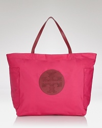 Work polished yet practical style into your wardrobe with this nylon and leather tote from Tory Burch. This covetable carryall is smart enough the office and roomy enough for get-out-of town essentials. Work polished yet practical style into your wardrobe with this nylon and leather tote from Tory Burch. This covetable carryall is smart enough the office and roomy enough for get-out-of town essentials.