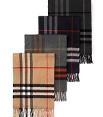 Soft, woven cashmere muffler with fringe in iconic check pattern.