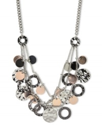 Nine West's shaky frontal necklace starts the night off right. The three-row design flaunts circular pendants in silver tone, hematite tone and rose-gold tones. Crafted in silver tone mixed metal. Approximate length: 18 inches + 2-inch extender. Approximate drop: 1-3/4 inches. Nine West's shaky frontal necklace starts the night off right. The three-row design flaunts circular pendants in silver tone, hematite tone and rose-gold tones. Crafted in silver tone mixed metal. Approximate length: 18 inches + 2-inch extender. Approximate drop: 1-3/4 inches.