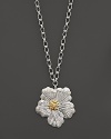 A delicate gardenia, captured at the height of its beauty in sterling silver and 18K yellow gold, blooms on this necklace from Buccellati.