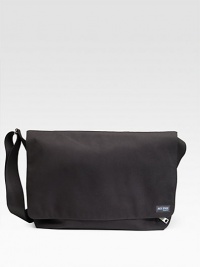A rugged, everyday look crafted in lasting denier canvas with a convenient laptop compartment. Grip tape closure Exterior zip pocket Interior zip and organizing pockets Laptop compartment Adjustable shoulder strap 18W X 11½H X 5½D Imported A rugged, everyday look crafted in lasting denier canvas with a convenient laptop compartment. Grip tape closure Exterior zip pocket Interior zip and organizing pockets Laptop compartment Adjustable shoulder strap 18W X 11½H X 5½D Imported