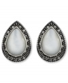 Shimmer and shine. Genevieve & Grace's pretty button stud earrings feature a Mother of Pearl center surrounded by glittering marcasite. Set in sterling silver. Earrings feature an omega clip-on backing for non-pierced ears. Approximate length: 7/8 inch. Approximate width: 5/8 inch.
