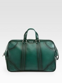 Green hand-stained leather duffel with perforated trim detail.Top zip closureLeather top handleInside pocket with a Gucci crest zipperFive metal feetVelvet Diamante liningLeather20.5W x 12.2H x 8DMade in Italy Green hand-stained leather duffel with perforated trim detail.Top zip closureLeather top handleInside pocket with a Gucci crest zipperFive metal feetVelvet Diamante liningLeather20.5W x 12.2H x 8DMade in Italy