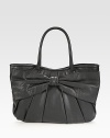 Italian calfskin leather in a classic top-handle silhouette, topped off with a center bow and elegant pleating. Double top handles, 7½ dropMagnetic snap closureOne inside zip pocketTwo inside open pocketsCotton lining16½W X 10¼H X 2¾DMade in Italy