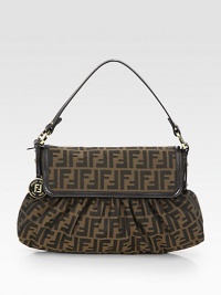 Iconic signature jacquard accented with luxuriously smooth leather trim.Double leather top handles, 7 dropMagnetic snap flap closureOne inside zip pocketCotton lining15W X 9H X 3DMade in Italy Iconic signature jacquard accented with luxuriously smooth leather trim.Double leather top handles, 7 dropMagnetic snap flap closureOne inside zip pocketCotton lining15W X 9H X 3DMade in Italy
