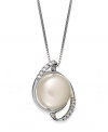 Capture a classic style. This sterling silver necklace suspends a cultured freshwater button pearl (11-12 mm) surrounded by swirls of diamonds for refined elegance. Approximate length: 18 inches. Approximate drop length: 3/4 inch. Approximate drop width: 1/2 inch.