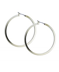 Must-have hoops with a little extra edge. GUESS style features a squared edge hoop in polished gold tone mixed metal. Approximate diameter: 1-1/2 inches. Must-have hoops with a little extra edge. GUESS style features a squared edge hoop in polished gold tone mixed metal. Approximate diameter: 1-1/2 inches.