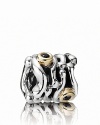 A swirling sterling silver PANDORA charm houses dramatic 14K gold bezel-set black diamonds.