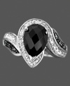 A unique ring of endless grace, featuring round-cut diamonds (1/10 ct. t.w.) and oval-cut onyx (10 x 7 mm) in a sterling silver setting. Size 7.