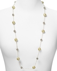 Embellished with delicate pearl and crystal stations, Carolee's illusion necklace sparkles with versatility -- elegant whether worn to dress up denim or enliven a classic white blouse. Embellished with delicate pearl and crystal stations, Carolee's illusion necklace sparkles with versatility -- elegant whether worn to dress up denim or enliven a classic white blouse.