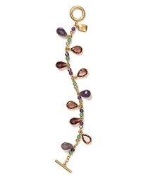 A distinctive dangle of precious stone beads, glass, and resin stoned dresses up this Lauren Ralph Lauren charm bracelet, finished with a simple toggle closure. A distinctive dangle of precious stone beads, glass, and resin stoned dresses up this Lauren Ralph Lauren charm bracelet, finished with a simple toggle closure.
