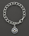 Evil eye charm bracelet with black, white and blue sapphires, gold accents and lobster clasp. Designed by Judith Ripka.