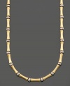 Simple style with a touch of the exotic. This bamboo necklace is crafted in 14k gold and sterling silver over sterling silver. Approximate length: 16 inches.