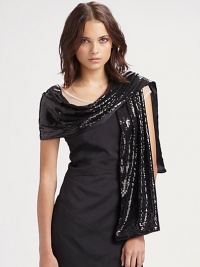 Dramatic evening stole with silk charmeuse lining. About 14 X 79 50% nylon/50% polyester 100% silk lining Dry clean Made in USA Dramatic evening stole with silk charmeuse lining. About 14 X 79 50% nylon/50% polyester 100% silk lining Dry clean Made in USA