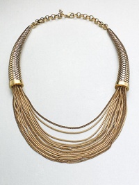 This unique statement piece features a mix of link and snake chains in a multi-row style with textured, horn-shaped endcaps. Antique-finished goldtoneLength, about 17Lobster clasp closureImported 