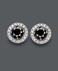 Sparkling studs add a bright and versatile touch to any look. Crafted in 14k white gold, earrings feature a round-cut black diamond center (7/8 ct. t.w.) encircled by sparkling, round-cut white diamonds (1/6 ct. t.w.). Approximate diameter: 1/3 inch. Sparkling studs add a bright and versatile touch to any look. Crafted in 14k white gold, earrings feature a round-cut black diamond center (7/8 ct. t.w.) encircled by sparkling, round-cut white diamonds (1/6 ct. t.w.). Approximate diameter: 1/3 inch.