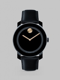 A sleek and modern timepiece designed with a minimalist tonal style, goldtone accents and Swiss quartz precision. Round bezel Quartz movement Water resistant to 3 ATM Stainless steel/composite case: 42mm (1.65) Leather strap Imported A sleek and modern timepiece designed with a minimalist tonal style, goldtone accents and Swiss quartz precision. Round bezel Quartz movement Water resistant to 3 ATM Stainless steel/composite case: 42mm (1.65) Leather strap Imported