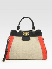 A roomy carryall crafted from linen with rich ostrich trim, and finished with a removable shoulder strap. Double top handles, 5¼ dropAdjustable, removable shoulder strap, 18¾-21 dropTurn-lock closureProtective metal feetTwo inside zip pocketsThree inside open pocketsSatin lining14¾W X 11¼H X 5½DMade in Italy A roomy carryall crafted from linen with rich ostrich trim, and finished with a removable shoulder strap. Double top handles, 5¼ dropAdjustable, removable shoulder strap, 18¾-21 dropTurn-lock closureProtective metal feetTwo inside zip pocketsThree inside open pocketsSatin lining14¾W X 11¼H X 5½DMade in Italy