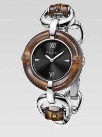 From the Bamboo Collection. This nature-inspired style features beautiful bamboo details mixed with sleek stainless steel. Swiss quartz movementWater resistant to 3 ATMRound stainless steel case, 35mm (1.4) Bamboo accented bezelBlack sun-brushed dialBar and Roman numeral hour markers at 3, 6, 9 and 12Bamboo accented stainless steel bangleMade in Switzerland Please note: Bamboo accents are not water resistant. From the Bamboo Collection. This nature-inspired style features beautiful bamboo details mixed with sleek stainless steel. Swiss quartz movementWater resistant to 3 ATMRound stainless steel case, 35mm (1.4) Bamboo accented bezelBlack sun-brushed dialBar and Roman numeral hour markers at 3, 6, 9 and 12Bamboo accented stainless steel bangleMade in Switzerland Please note: Bamboo accents are not water resistant.