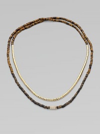 Beautifully textured, tiger's eye-inspired beads, radiant goldtone beads and a single rhinestone encrusted bead in a long strand, perfect for double-wrapping. Epoxy and brass beadsGlass stonesLength, about 24Slip-on styleImported Beautifully textured, tiger's eye-inspired beads, radiant goldtone beads and a single rhinestone encrusted bead in a long strand, perfect for double-wrapping. Epoxy and brass beadsGlass stonesLength, about 24Slip-on styleImported