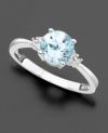 A large, round-cut aquamarine (1-1/10 ct. t.w.) with a trio of diamond accents shimmering at each side. Set in 14k white gold.