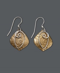 There's nothing wrong with being a little unconventional. These artsy earrings by Jody Coyote feature a unique, textured brass drop and sterling silver wire swirl charm. Sterling silver french wire and accent bead. Approximate drop: 1-1/4 inches. There's nothing wrong with being a little unconventional. These artsy earrings by Jody Coyote feature a unique, textured brass drop and sterling silver wire swirl charm. Sterling silver french wire and accent bead. Approximate drop: 1-1/4 inches.