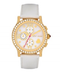 Never miss an opportunity to shine. Betsey Johnson doesn't on this watch crafted of a white leather strap and round gold tone stainless steel case. Bezel embellished with crystal accents. White mother-of-pearl chronograph dial features gold tone dot markers, Roman numerals, three subdials, heart at four o'clock, gold tone hour and minute hands, signature fuchsia second hand and logo. Quartz movement. Water resistant to 30 meters. Two-year limited warranty. Never miss an opportunity to shine. Betsey Johnson doesn't on this watch crafted of a white leather strap and round gold tone stainless steel case. Bezel embellished with crystal accents. White mother-of-pearl chronograph dial features gold tone dot markers, Roman numerals, three subdials, heart at four o'clock, gold tone hour and minute hands, signature fuchsia second hand and logo. Quartz movement. Water resistant to 30 meters. Two-year limited warranty.