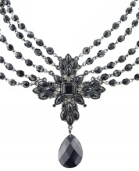 Dramatically decorative. Elaborate jet beading and a cross design add allure to this multi-row bib necklace from 2028. Featuring a faceted pendant, it's set in silver tone mixed metal. Approximate length: 16 inches + 3-inch extender. Approximate drop: 3-3/4 inches. Dramatically decorative. Elaborate jet beading and a cross design add allure to this multi-row bib necklace from 2028. Featuring a faceted pendant, it's set in silver tone mixed metal. Approximate length: 16 inches + 3-inch extender. Approximate drop: 3-3/4 inches.