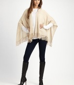 A casual style with an open drape front, warm hood and pretty fringe details in luxurious cashmere. HoodedOpen, draped frontPull-over styleFringed hemAbout 28 from back shoulder to hemCashmereDry cleanImported 