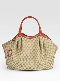 Rounded design in GG fabric features pleating detail, leather trim and light goldtone hardware accents. Double straps, 7 drop Snap closure Side snaps Inside zipper pocket Cotton lining 18W X 14½H X 6D Made in Italy Rounded design in GG fabric features pleating detail, leather trim and light goldtone hardware accents. Double straps, 7 drop Snap closure Side snaps Inside zipper pocket Cotton lining 18W X 14½H X 6D Made in Italy