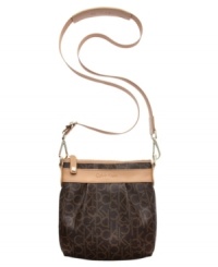 A relaxed crossbody silhouette is dressed up in eye-catching signature lettering and soft leather trim. This take-anywhere Calvin Klein design is perfect for an afternoon in town or a weekend away. And the surprisingly roomy interior fits wallet, keys, phone and makeup purse with ease. A relaxed crossbody silhouette is dressed up in eye-catching signature lettering and soft leather trim. This take-anywhere Calvin Klein design is perfect for an afternoon in town or a weekend away. And the surprisingly roomy interior fits wallet, keys, phone and makeup purse with ease.