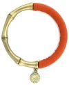 One part Zen and one part colorblock equals two parts fabulous! Jessica Simpson's totally-chic bangle features a serene bamboo setting in gold tone mixed metal combined with stretchable bright orange polyurethane. Approximate length (when stretched): 10 inches.