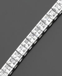 A beautiful tennis bracelet with a sophisticated air. Gorgeous princess-cut cubic zirconias (9 ct. t.w.) are set in sterling silver finished in platinum, by CRISLU. Approximate length: 7 inches. A beautiful tennis bracelet with a sophisticated air. Gorgeous princess-cut cubic zirconias (9 ct. t.w.) are set in sterling silver finished in platinum, by CRISLU. Approximate length: 7 inches.
