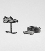 If the shoe fits, wear it on your sleeve with these sterling silver and black rhodium cuff links.Sterling silverShoe horn-shaped backAbout .87 diam.Made in USA