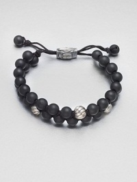 Smooth and polished beaded bracelet of black onyx and sterling silver with logo-engraved clasp.Black onyxSterling silverAdjustable claspAbout 2½ diam.Imported Smooth and polished beaded bracelet of black onyx and sterling silver with logo-engraved clasp.Black onyxSterling silverAdjustable claspAbout 2½ diam.Imported