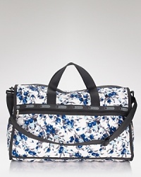 Cooly blending practical design with a fashionable feel, LeSportsac' printed nylon duffel makes a smart travel companion. Cooly blending practical design with a fashionable feel, LeSportsac' printed nylon duffel makes a smart travel companion.