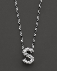 From the Tiny Treasures collection, a diamond S necklace. With signature ruby accent. Designed by Roberto Coin. From the Tiny Treasures collection, a diamond S necklace. With signature ruby accent. Designed by Roberto Coin.
