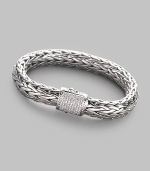 A rich woven chain of sterling silver with a barrel clasp of 18k white gold and pavé diamonds. Diamonds, 0.62 tcw Sterling silver and 18k white gold Length, about 7½ Width, about ¼ Push-lock clasp Made in Bali