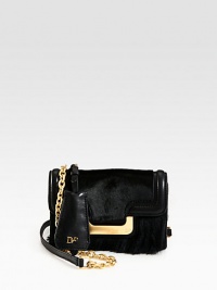 A textured blend of haircalf, faux mink and leather accented with radiant hardware.Chain and leather shoulder strap, 23¼ dropMagnetic snap flap closureOne outside open pocketOne inside zip pocketFully lined7¼W X 5H X 2¼DImported A textured blend of haircalf, faux mink and leather accented with radiant hardware.Chain and leather shoulder strap, 23¼ dropMagnetic snap flap closureOne outside open pocketOne inside zip pocketFully lined7¼W X 5H X 2¼DImported