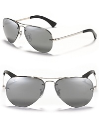 Timeless aviator sunglasses with a rimless frame and a rounded double bridge design. Timeless aviator sunglasses with a rimless frame and a rounded double bridge design.