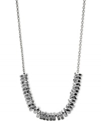 Fossil's necklace gets a something extra in the way of style. Crafted from silver-tone stainless steel, the necklace dazzles with sparkling accents and rounded beads. Approximate length: 16 inches + 2-inch extender. Fossil's necklace gets a something extra in the way of style. Crafted from silver-tone stainless steel, the necklace dazzles with sparkling accents and rounded beads. Approximate length: 16 inches + 2-inch extender.