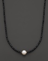 Black onyx beaded necklace with a single freshwater pearl.