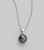 From the South Sea Collection. Elegantly simple with a black, round cultured South Sea pearl hanging from a chain of 18k white gold. 9mm black round cultured pearl Quality: A+ 18k white gold Length, about 18 Spring ring clasp Imported