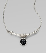 A single, glossy dome of black agate on a curved bar and a link chain. SilvertoneBlack agateLength, about 18Pendant size, about ½Lobster clasp closureMade in USA