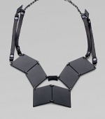 Pieced together diamond-shape brass plaques and strips of rich Italian leather come together in this street-smart, edgy design.Black, powder-coated brassLeatherHematite finish chainLength, about 19Lobster claspMade in USA