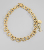 Bold, textured golded links are accented with two YSL logo charms. Goldtone Length, about 13 Toggle closure Made in Italy